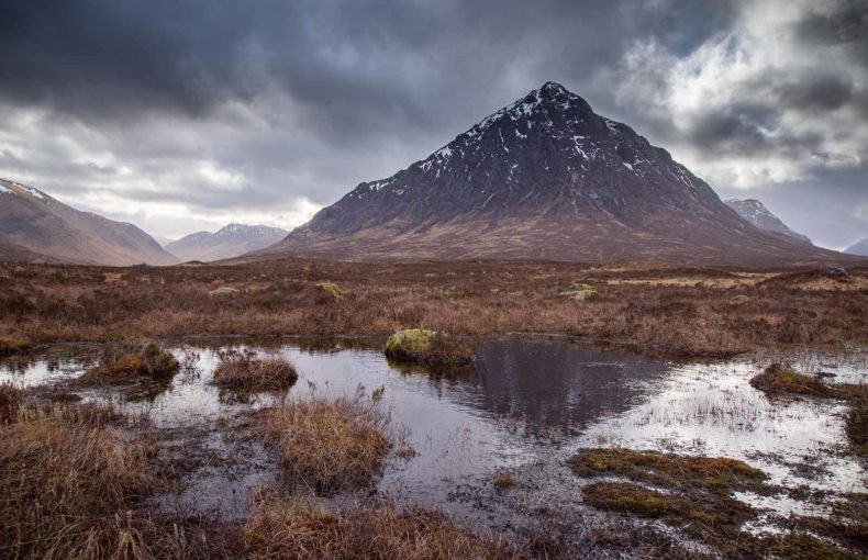 Buachaille Etive Mor, Glencoe, Scotland reflected in the water of a peat bog