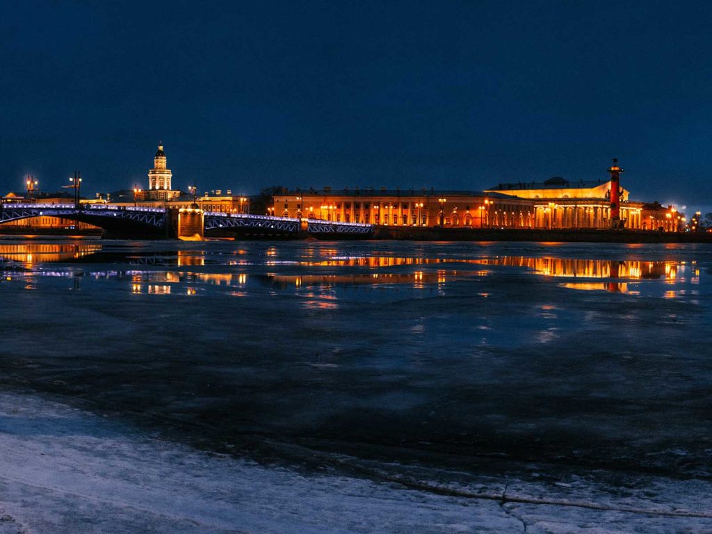 View on Spit of Vasilyevsky Island, Palace Bridge, Old Saint Petersburg Stock Exchange, and Rostral Columns from Neva River