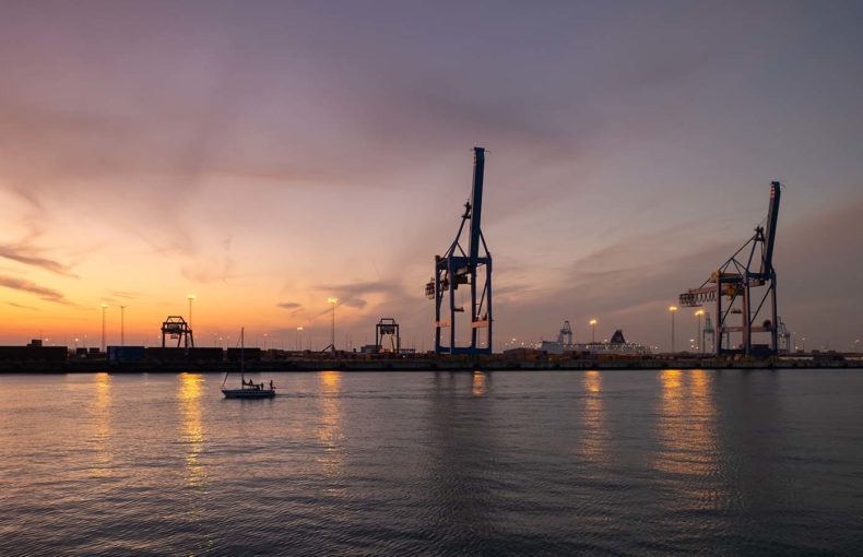 Container terminal in the port of Zeebrugge, Belgium at sunset