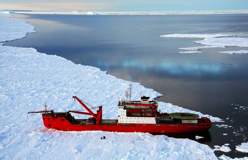 Cargo ship arrives in port for unloading on an ice floe