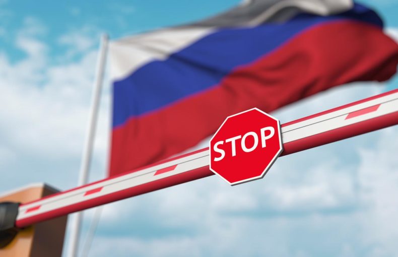 Barrier gate being closed with flag of Russia as a background