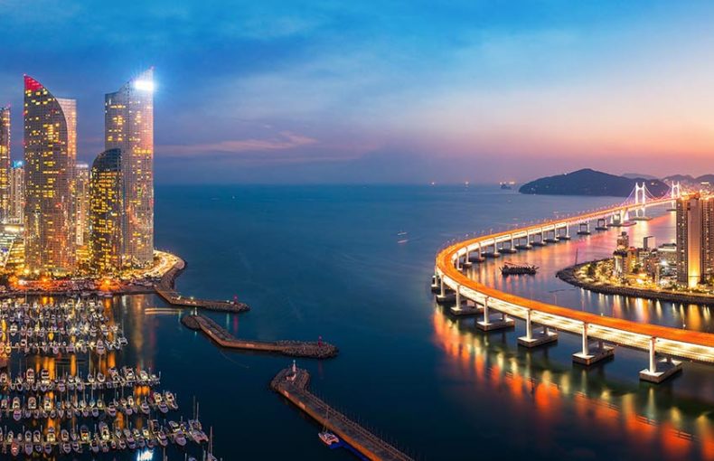 Sunset in Busan city with building, bridge and harbor, Korea, Asia