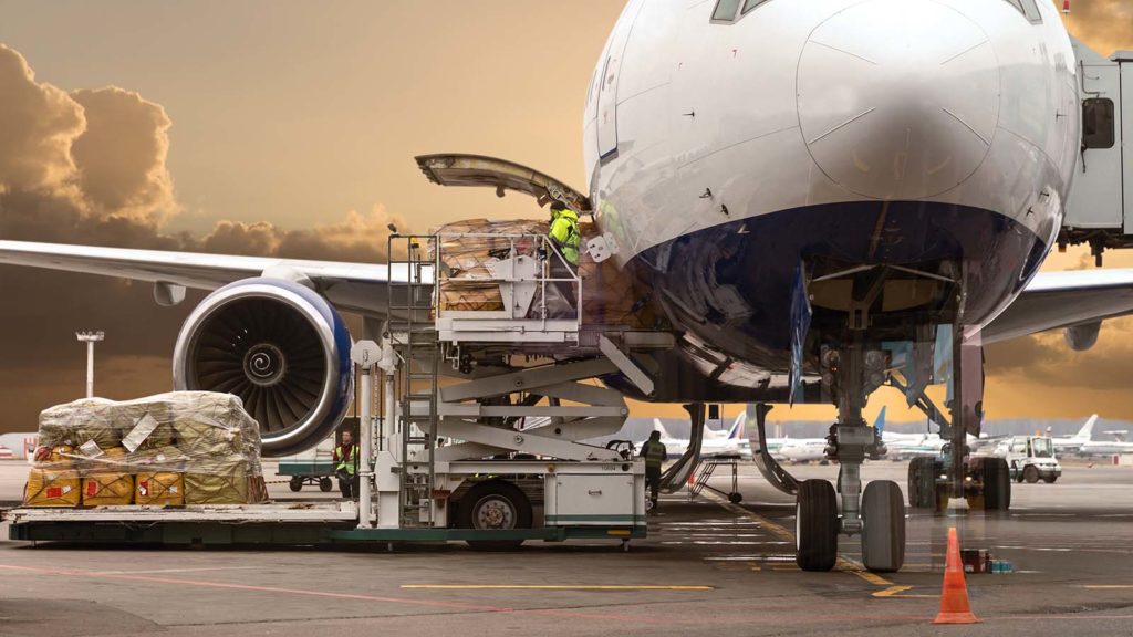 Loading cargo on the plane in airport