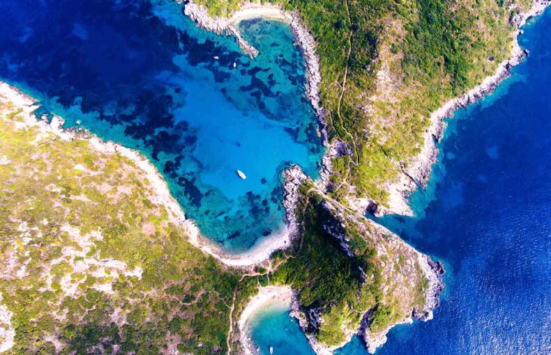 Aerial view from plane of islands surrounded by blue sea water in summer