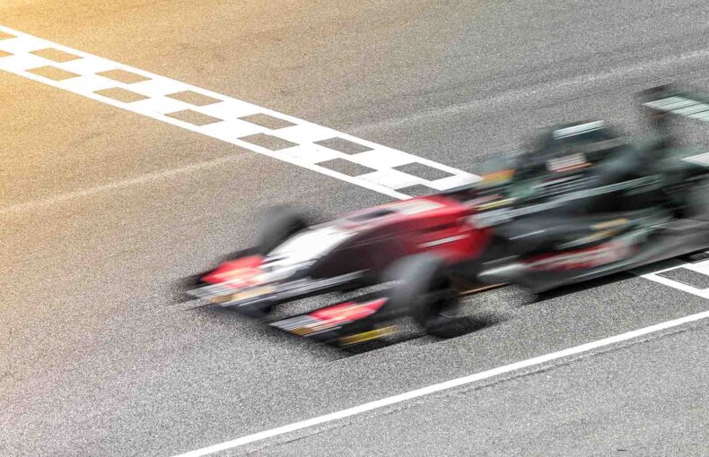Motion blur of Formula One car on race track