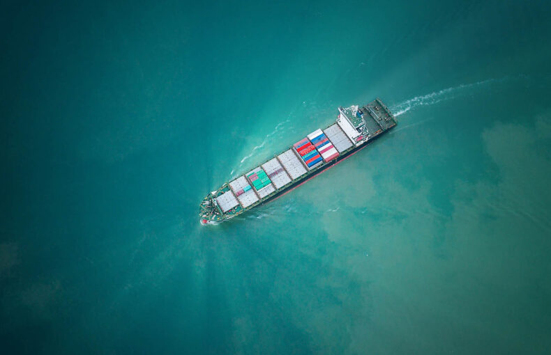 Aerial view of a container ship sailing at midsea